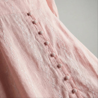 Closeup of Peach Aura blush modest maxi dress with long sleeves